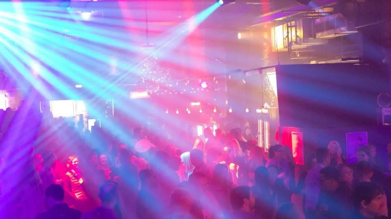 Atmospheric event lighting across a dance floor