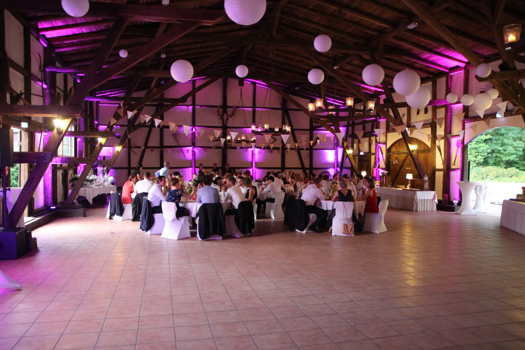 Elegant uplit reception room prepared for a wedding celebration
